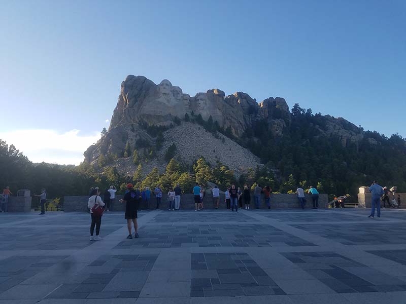 mount rushmore, people gathered around